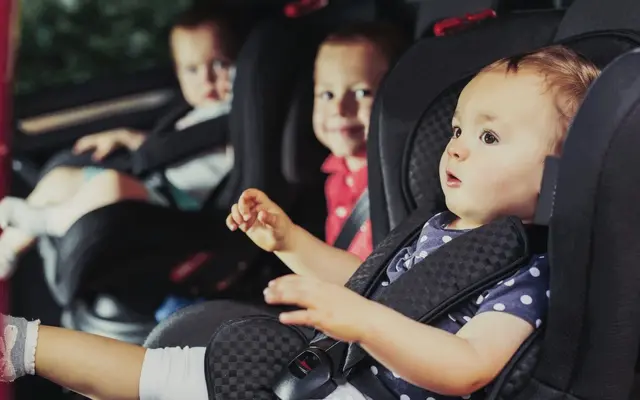 Family traveling with kids by car comfortable Mercedes V-Class luxury interior child seats