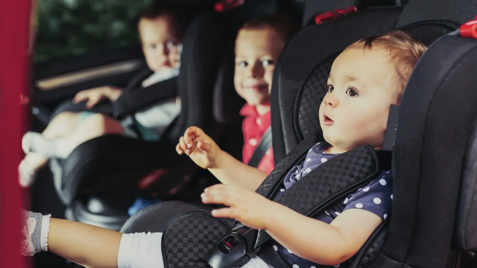 Family traveling with kids by car comfortable Mercedes V-Class luxury interior child seats