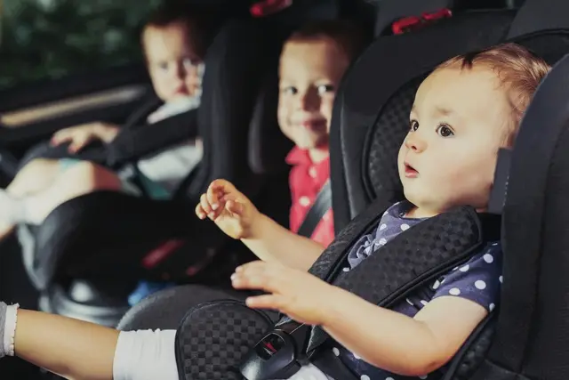 Family traveling with kids by car comfortable Mercedes V-Class luxury interior child seats